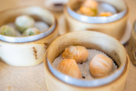 Photo for Traditional chinese steamed dim sum in basket - Royalty Free Image