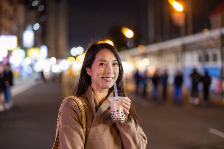 Photo for Woman drink with Bubble milk tea in street market - Royalty Free Image