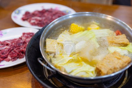 Photo for Fresh raw slice of beef in Hot Pot restaurant - Royalty Free Image