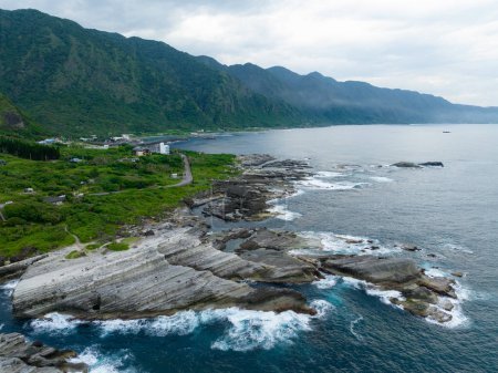 Photo for Drone fly over Taiwan Hualien rice field over the sea in Fengbin Township, Shitiping Coastal Stone Step Plain - Royalty Free Image
