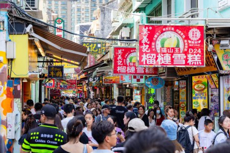 Photo for Macau - 02 July 2023: Crowded of people in Souvenir street in Taipa - Royalty Free Image