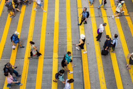 Photo for Hong Kong - 23 June 2023: Top down view of people cross the road - Royalty Free Image