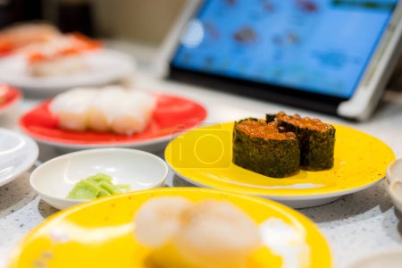 Photo for Different dish of the Japanese sushi in conveyor belt sushi shop - Royalty Free Image