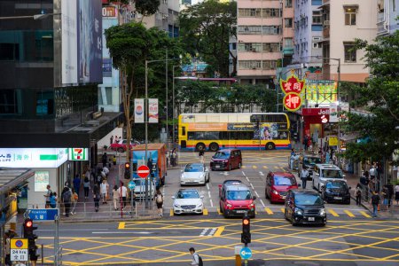 Photo for Hong Kong - 20 June 2023: Hong Kong city with pedestrian cross the road in causeway bay district - Royalty Free Image