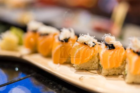 Photo for Salmon maki roll dish in Japanese restaurant - Royalty Free Image