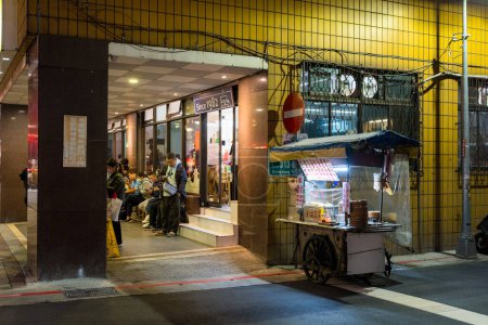 Photo for Taipei, Taiwan - 26 November 2023: Vendor food stall in the street in Taipei city at night - Royalty Free Image