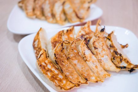 Photo for Pan fried meat dumpling in restaurant - Royalty Free Image
