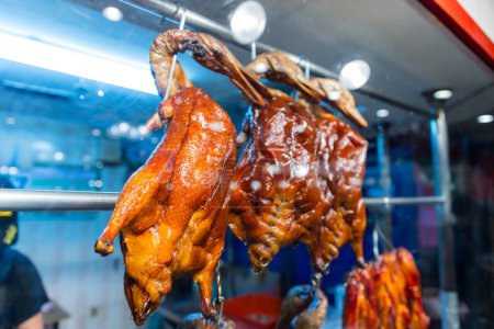 Photo for Chinese restaurant traditional roast goose hanging up in the kitchen - Royalty Free Image