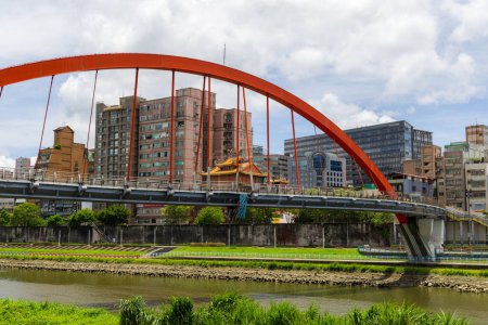 Photo for Taipei, Taiwan - 25 July 2023: Red bridge over the river in Taipei city - Royalty Free Image