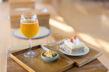 Photo for Slice of cake with glass of tea in coffee shop - Royalty Free Image