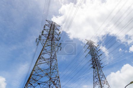 Photo for Pylon and high voltage powerline over the blue sky - Royalty Free Image