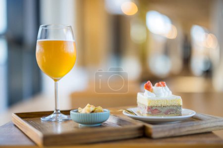 Photo for Slice of cake with glass of tea in coffee shop - Royalty Free Image