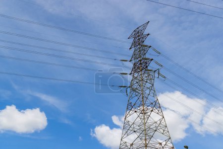 Photo for Pylon and high voltage powerline over the blue sky - Royalty Free Image