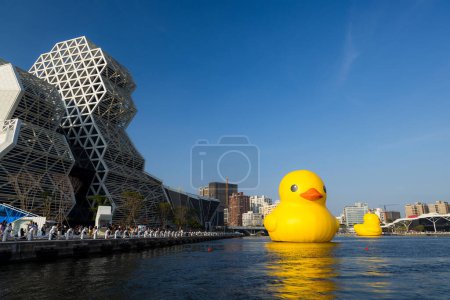 Photo for Taiwan - 01 February 2024: Kaohsiung Music Center with yellow duck floating over the bay - Royalty Free Image