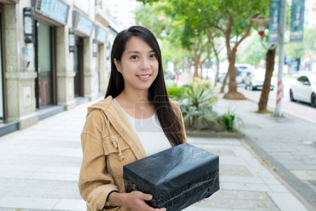 Photo for Woman hold with her parcel - Royalty Free Image