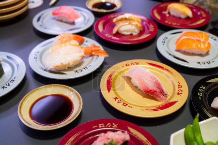 Photo for Taiwan - 15 December 2023:  Dishes of Sushi in the Sushiro Japanese restaurant - Royalty Free Image