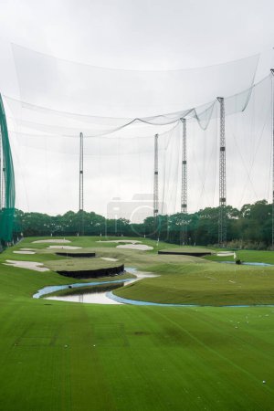 Photo for Golf driving range made of large green wire mesh - Royalty Free Image