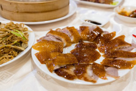 Photo for Slice of peking duck dish in chinese restaurant - Royalty Free Image