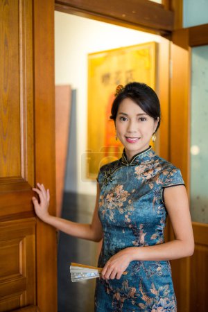 Photo for Woman wear traditional chinese cheongsam and smile to the camera - Royalty Free Image
