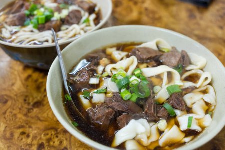 Photo for Spicy red soup beef noodle in a bowl - Royalty Free Image