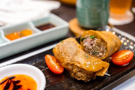 Photo for Deep fry spring roll with tomato in the restaurant - Royalty Free Image