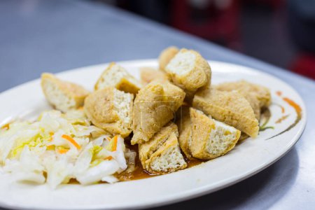 Photo for Deep fry stinky tofu on the dish - Royalty Free Image