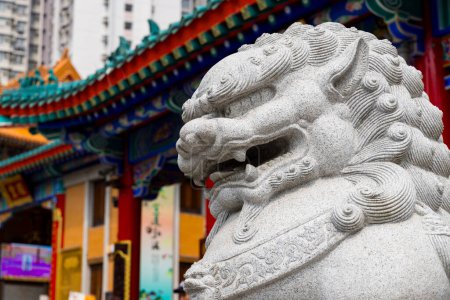 Estatua de león en el templo de Wong Tai Sin en la ciudad de Hong Kong