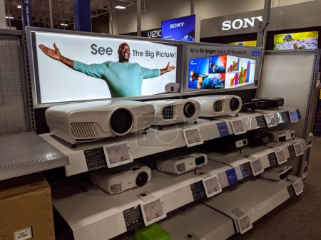 Photo for Honolulu -  November 2 2019:  Shaq Say See The Big Picture advertising Epson Projectors on display at Best Buy Store.  Seiko Epson Corporation, or simply Epson, is a Japanese electronics company and one of the world's largest manufacturers of compute - Royalty Free Image