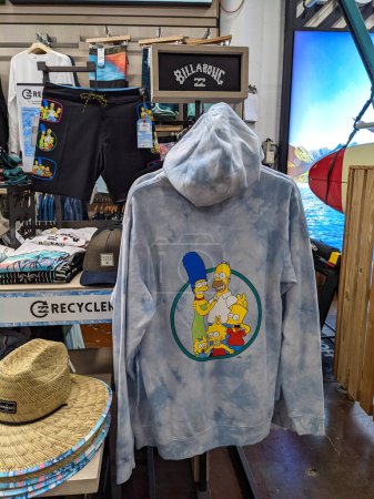 Photo for Honolulu - November 27, 2021:  Billabong Simpson hoodie and swimshorts clothing for sale inside store. - Royalty Free Image