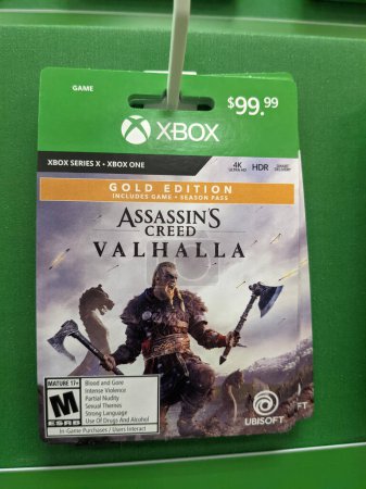 Téléchargez les photos : Honolulu - September 28, 2021: Assassin's Creed Valhalla Gold Edition for Xbox Series X and One Full Game Digital Code by Ubisoft for sale at Target Store. - en image libre de droit