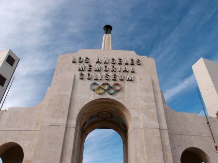 Photo for Los Angeles - January 21, 2014: A striking image of the iconic Los Angeles Memorial Coliseum sign perched on top of the historic building. The bold letters of the sign stand out against the blue sky, symbolizing the proud history and tradition of the - Royalty Free Image