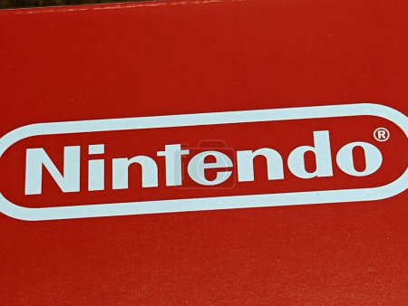 Photo for Honolulu - March 10, 2022: Get ready to level up with the iconic Nintendo logo, proudly displayed in red and white on the box of this game system. As one of the world's largest video game companies, Nintendo has created some of the most beloved franc - Royalty Free Image