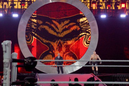 Photo for Santa Clara, California - March 29, 2015: WWE Champion Brock Lesnar and his agent Paul Heyman make a grand entrance at Wrestlemania 31, the showcase of the immortals, as night falls over the Levi's Stadium. The crowd cheers loudly for the Beast Incar - Royalty Free Image