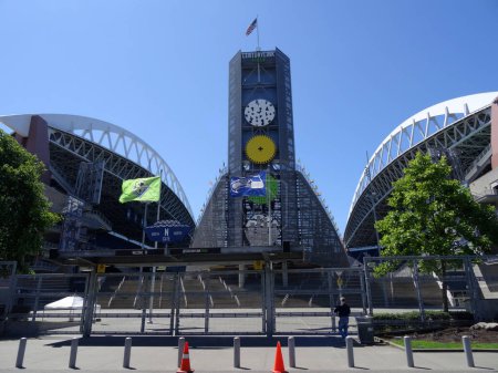 Photo for Seattle - June 26, 2016:  A USA flag flies proudly over CenturyLink Field, a multi-purpose stadium. The stadium is the home of the Seattle Seahawks (NFL) and the Seattle Sounders FC (MLS). - Royalty Free Image
