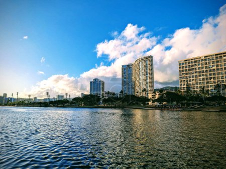 Serene banks of the Ala Wai Canal, an artificial waterway in Honolulu, Hawaii. The canal, stretching 1.5 miles (2.4 km), serves as the northern boundary of the vibrant Waikiki tourist district. 