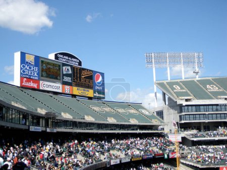 Photo for Oakland - April 15, 2009: A baseball game in progress at Oakland-Alameda County Coliseum with fans in the stands. - Royalty Free Image