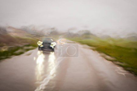 Photo for Driving during the rain, producing an impressionistic effect and a blurry image of a moving car. Photography taken - Royalty Free Image