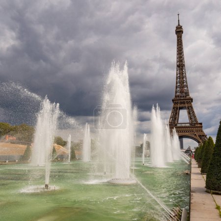 Photo for Paris, France - August 29 2023: Eiffel tower seen from Trocadero Fountains in a cloudy day. Squared  photography taken in Paris. - Royalty Free Image