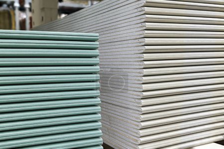 Photo for Drywall sheets stacks. Plasterboard sheets are stacked on top of each other. Construction and repair material. Closeup view. - Royalty Free Image