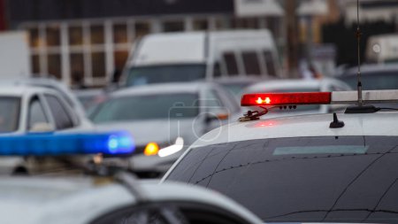Photo for Police cars lights at the city street at cloudy day, closeup - Royalty Free Image