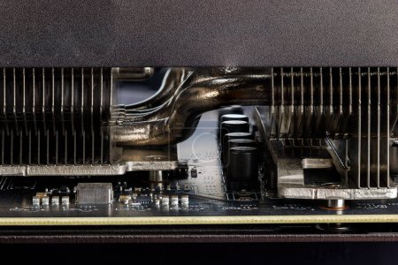 Photo for Closeup view of modern graphics card cooler with heatpipes between radiators. - Royalty Free Image
