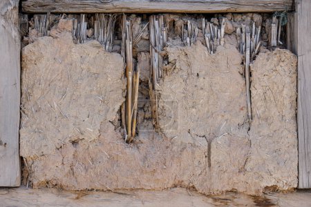 old damaged wattle and daub covered window, full-frame background and texture.