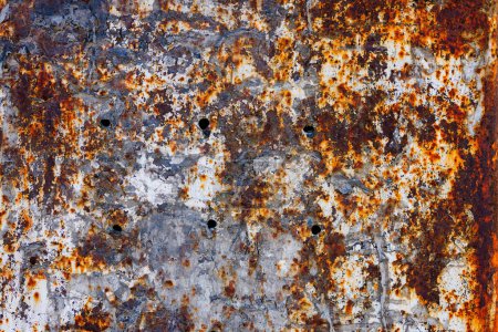 Mur de fer rouillé avec une épaisse couche de peinture érodée et épluchée. Cadre complet fond plat et texture.