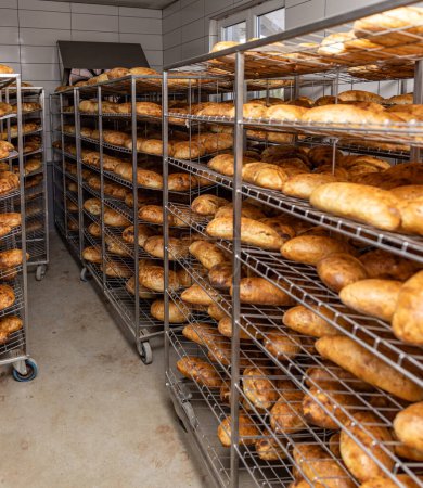 Photo for Rack of bread at the bakery. Industrial bread production - Royalty Free Image
