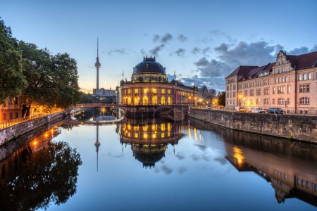 Photo for The Bode-Museum and the Television Tower reflected in the river Spree in Berlin before sunrise - Royalty Free Image