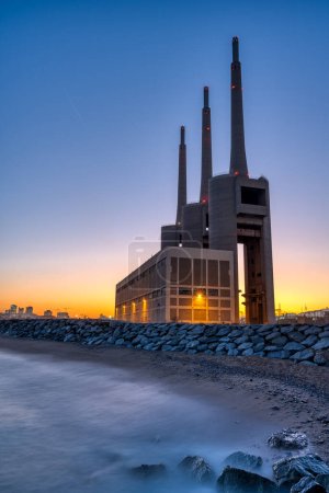 Photo for The decommissioned thermal power station at Sant Adria near Barcelona after sunset - Royalty Free Image