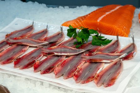 Photo for Sardines and salmon fillet for sale at a market in Barcelona - Royalty Free Image