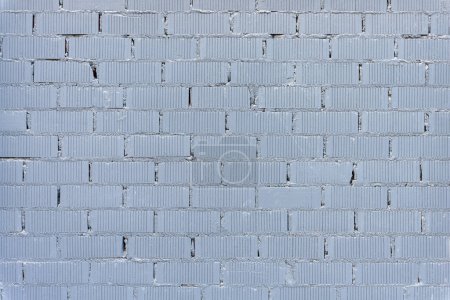 Background from a wall made of gray painted bricks