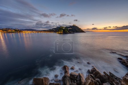 Photo for The bay of San Sebastian in Spain with the Monte Igueldo at sunset - Royalty Free Image