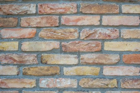 Background from a beige and orange brick wall